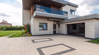 Newly completed custom home exterior with stone and timber accents under a Montana sky