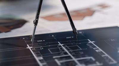 Architectural blueprints and plans laid out during pre-construction planning