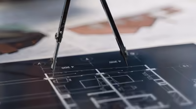 Architectural blueprints and plans laid out during pre-construction planning