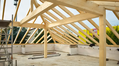 New home roof structure under construction with exposed timber trusses