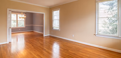 Bright room with newly installed glossy honey-oak hardwood flooring