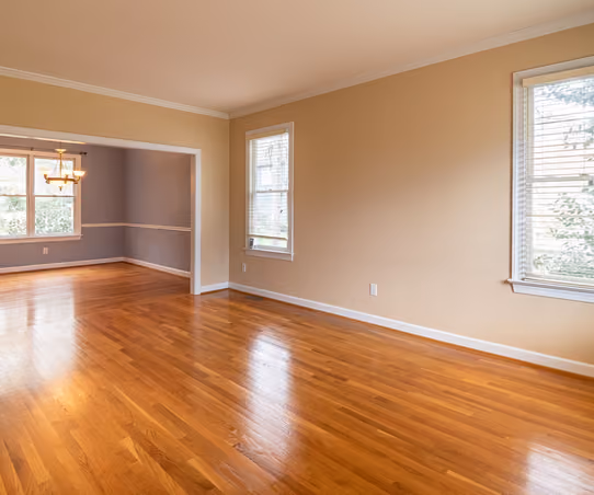 Bright room with newly installed glossy honey-oak hardwood flooring