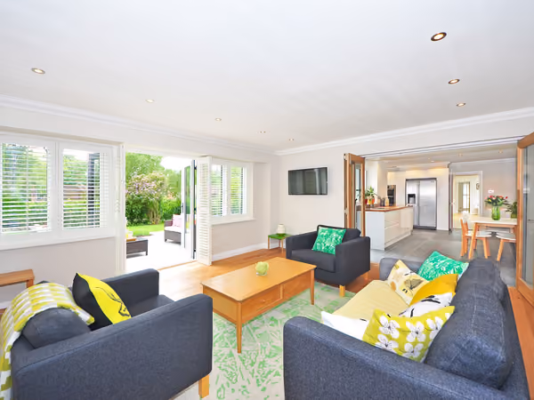 Bright, finished open-plan living space added onto an existing home