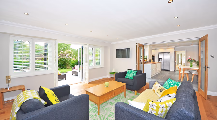 Bright, finished open-plan living space added onto an existing home
