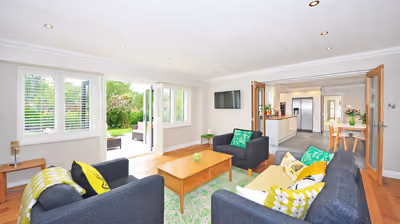 Bright, finished open-plan living space added onto an existing home