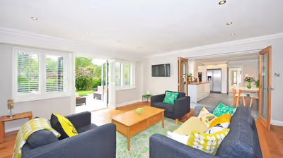 Bright, finished open-plan living space added onto an existing home