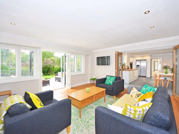 Bright, finished open-plan living space added onto an existing home