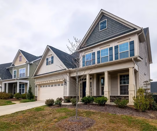 Beautifully renovated Montana home exterior with fresh siding, new windows, and landscaped entry