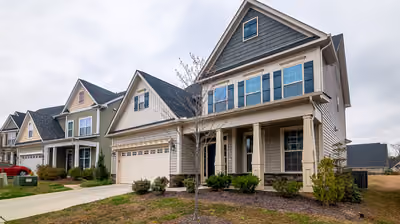 Beautifully renovated Montana home exterior with fresh siding, new windows, and a landscaped entry