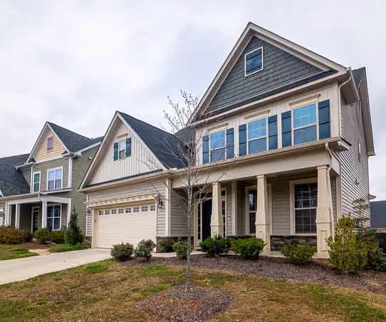 Beautifully renovated Montana home exterior with fresh siding, new windows, and landscaped entry