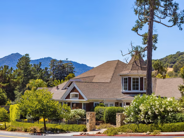 Completed luxury home with a mountain backdrop
